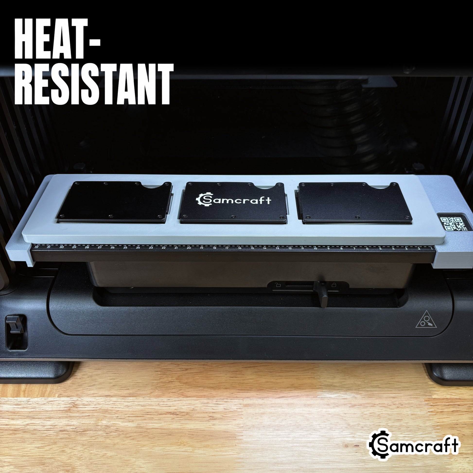 Samcraft Metal Wallet Jig seated on the eufyMake E1 print bed with three metal wallets ready to print