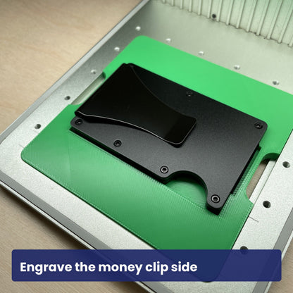 Metal wallet jig holding a wallet turned to show the money clip side.