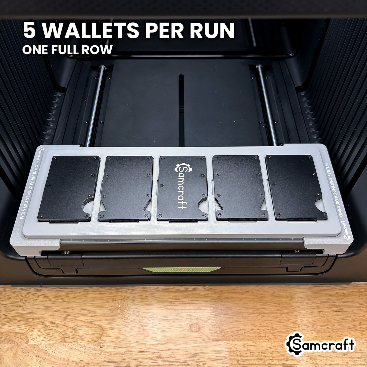Samcraft wallet jig for the xTool Omni loaded with five metal card holder wallets, a full row in one pass.