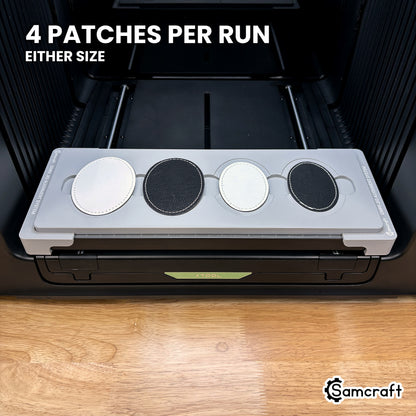 Samcraft patch jig for the xTool Omni loaded with four leatherette oval patches, printed in either of two sizes.