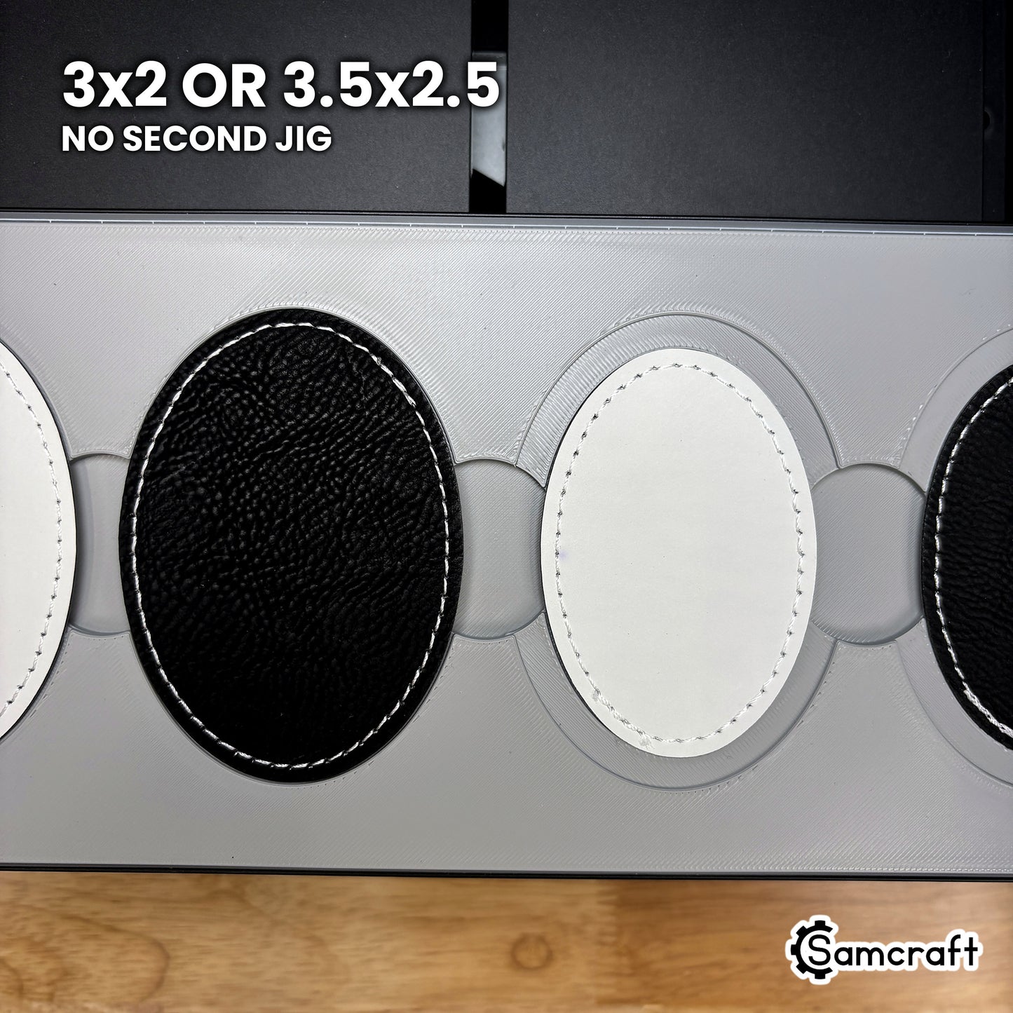 Both JDS leatherette oval patch sizes, 3 by 2 inch and 3.5 by 2.5 inch, seated in the Samcraft xTool Omni jig with no second jig needed.