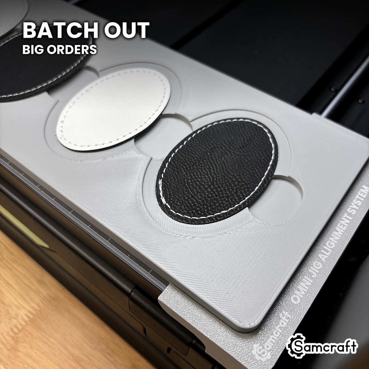 Samcraft xTool Omni oval patch jig filled with four leatherette patches, ready for club, team and merchandise batch orders.