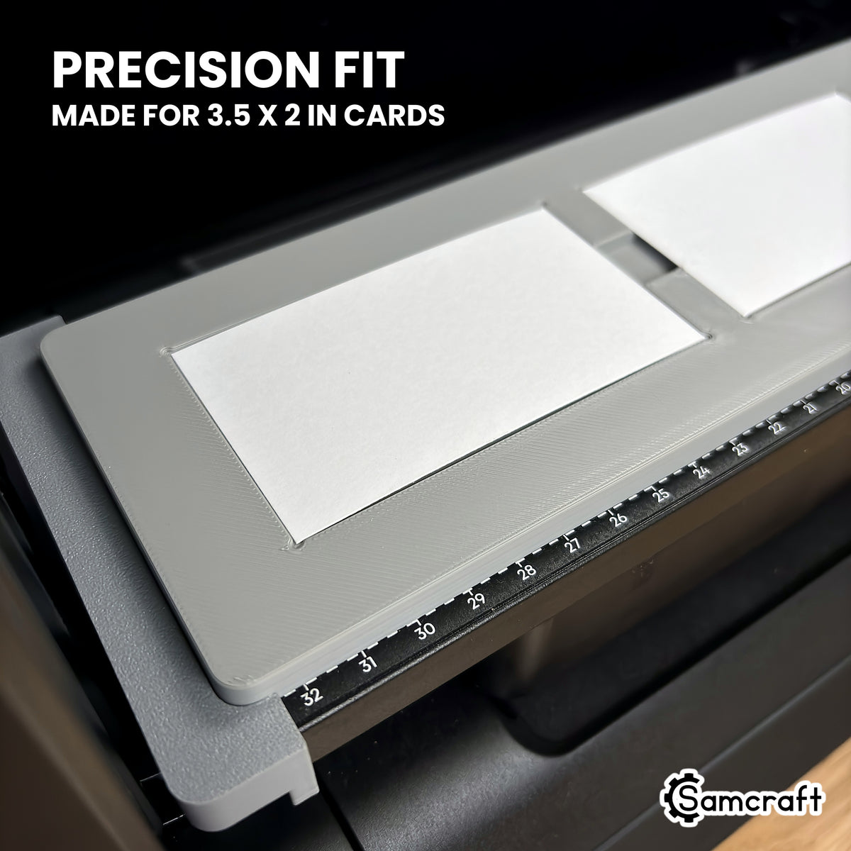 Close-up of a white 3.5 x 2 inch business card sitting flush in its pocket in the Samcraft eufyMake E1 jig.