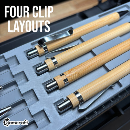 Detail of four bamboo pens showing different chrome clip orientations in the Samcraft Universal Pen Jig's recess relief cutouts on the eufyMake E1.