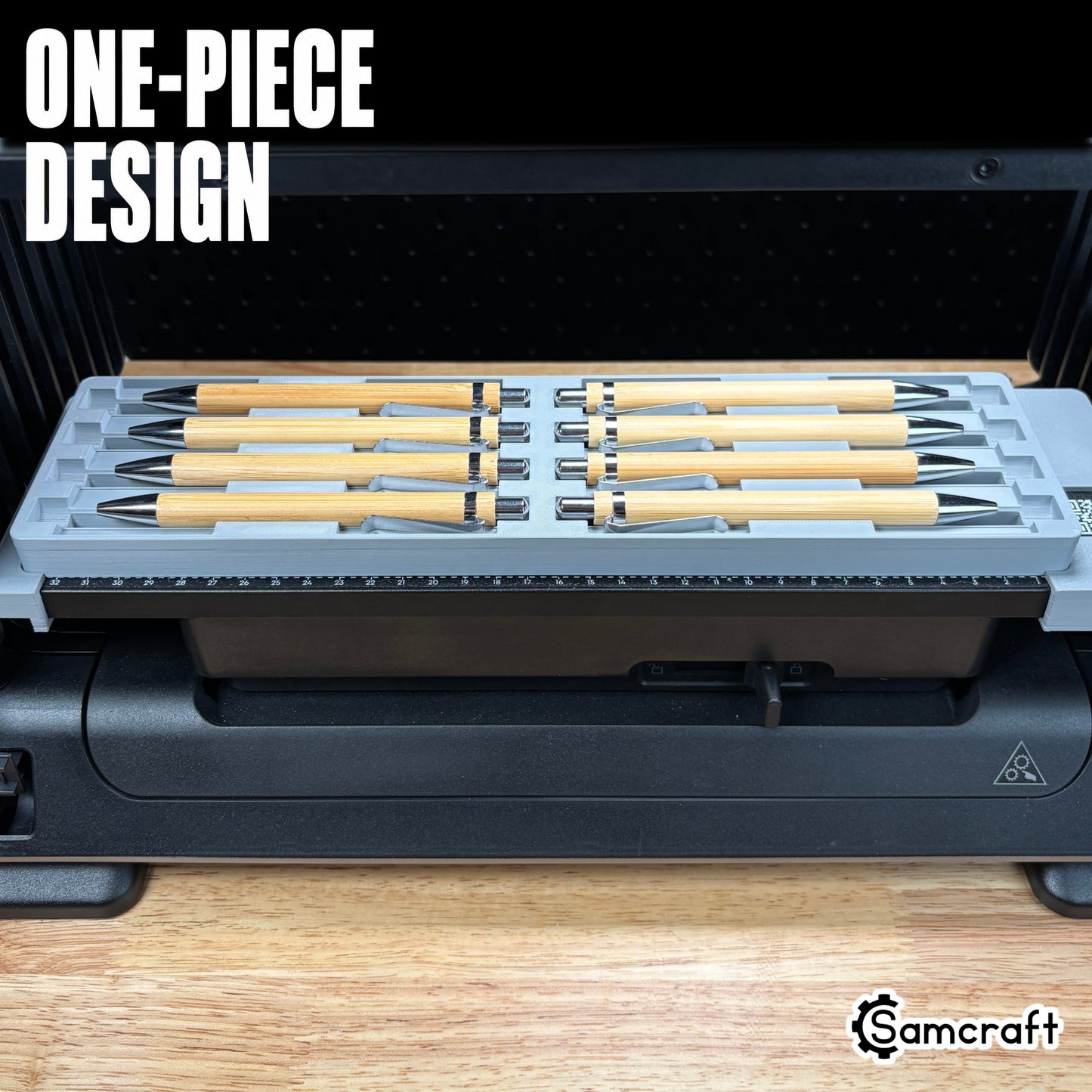 Front view of the one-piece Samcraft Universal Pen Jig loaded with eight bamboo pens in two rows on the eufyMake E1 UV printer.