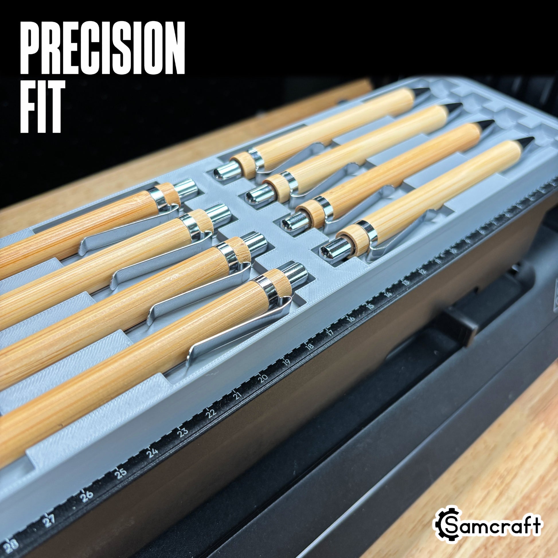 Close-up of bamboo pens with chrome clips seated in the Samcraft Universal Pen Jig's precision-fit channels, showing tight tolerance and alignment ruler on the eufyMake E1.