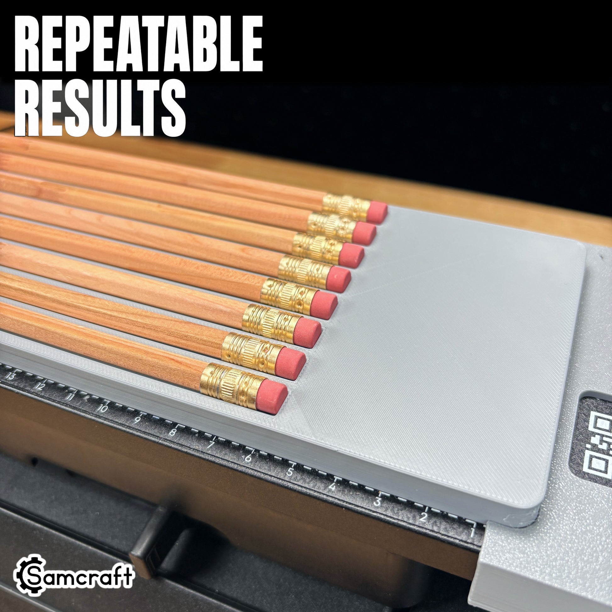 Close-up of wooden pencil erasers and ferrules lined up evenly in the Samcraft jig, demonstrating repeatable results and the built-in measurement ruler on the eufyMake E1.
