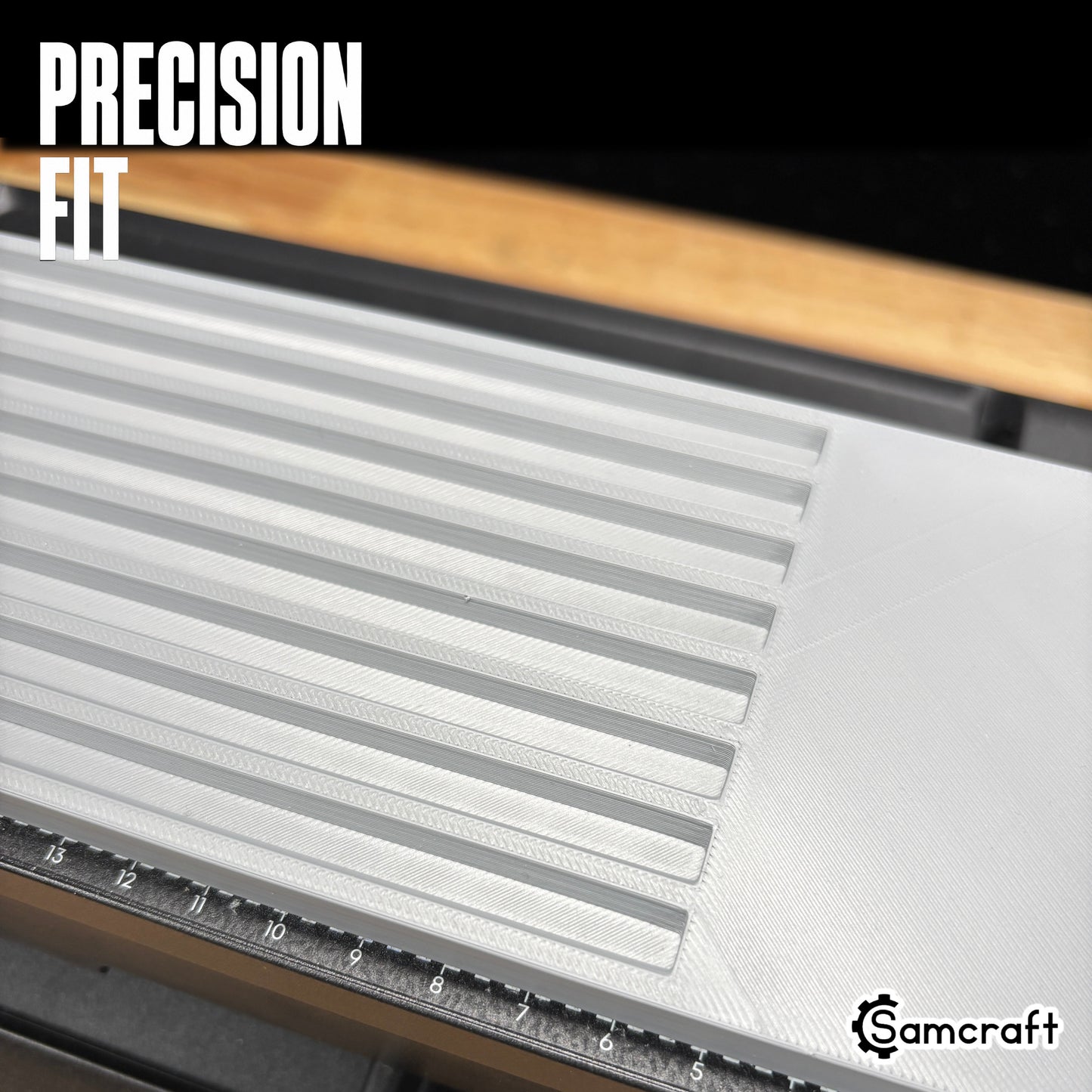 Detail of the Samcraft Pencil Jig's precision-fit parallel channels in a durable gray tray with built-in ruler, mounted on the eufyMake E1 UV printer.