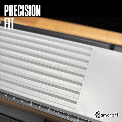 Detail of the Samcraft Pencil Jig's precision-fit parallel channels in a durable gray tray with built-in ruler, mounted on the eufyMake E1 UV printer.