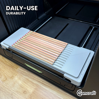 Samcraft hexagon pencil jig in high-temperature rated plastic holding twelve pencils on the xTool Omni bed, built for daily use.
