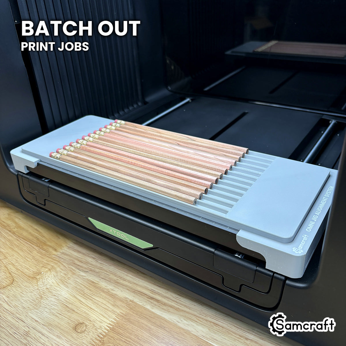 Samcraft hexagon pencil jig filled with twelve pencils on the xTool Omni UV printer, ready to batch out print jobs.