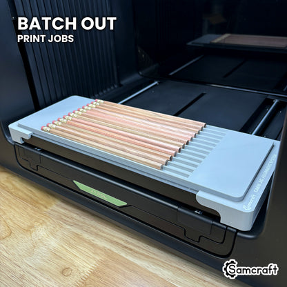 Samcraft hexagon pencil jig filled with twelve pencils on the xTool Omni UV printer, ready to batch out print jobs.