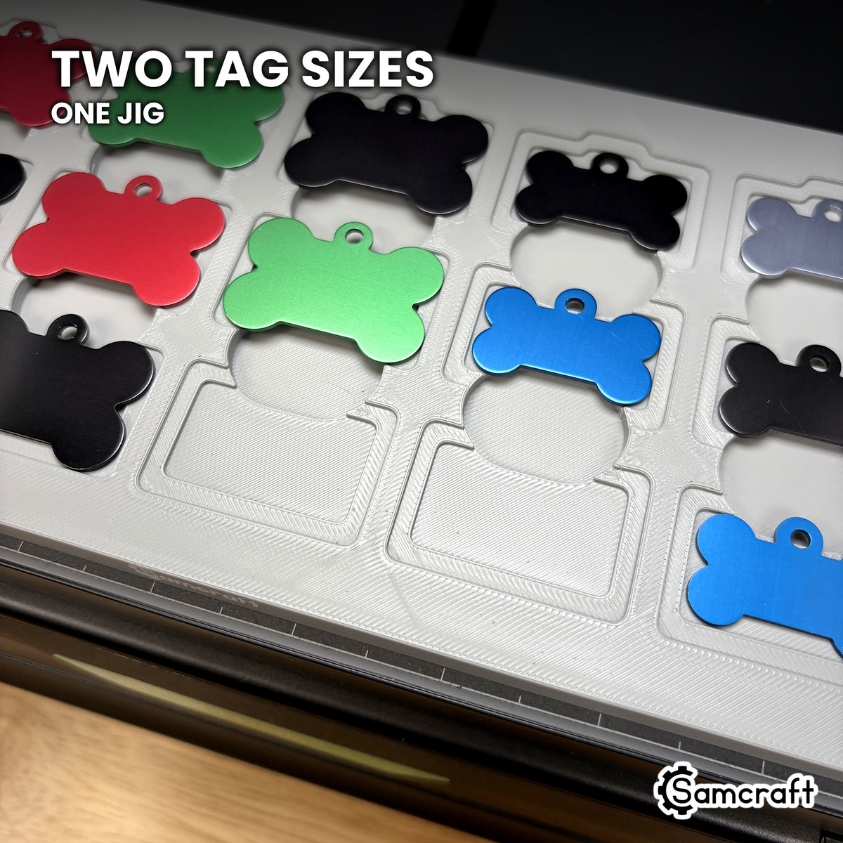 Close-up of the Samcraft bone pet tag jig showing both tag sizes seated in nested recesses, the larger tag in the outer step and the smaller in the inner recess.