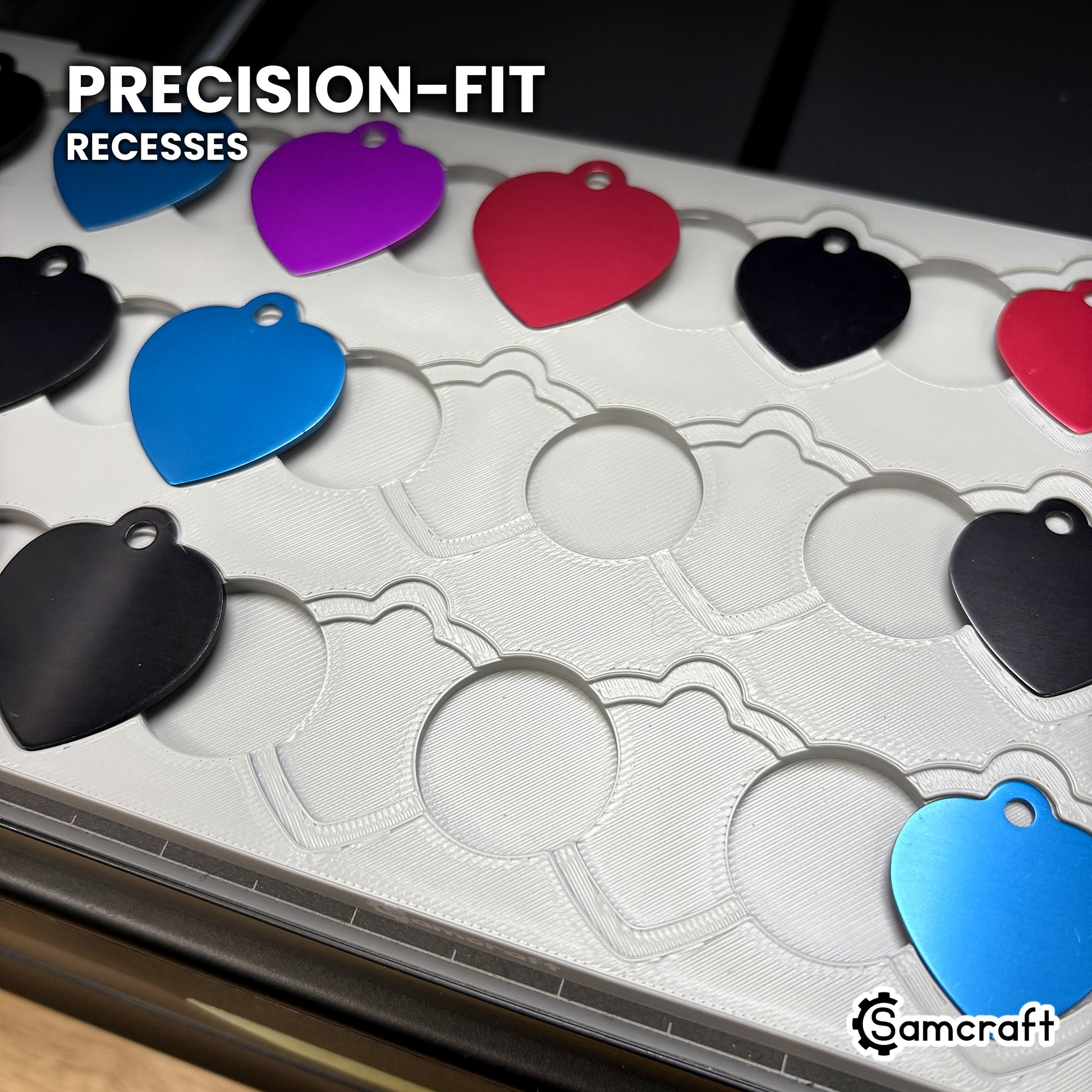 Close-up of the empty nested recesses in the Samcraft heart pet tag jig, showing the precision-fit outer step and inner recess at every position.
