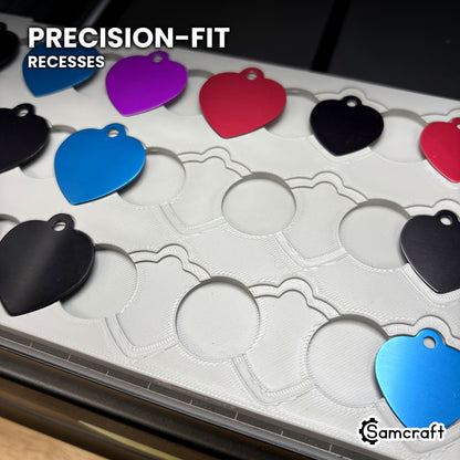 Close-up of the empty nested recesses in the Samcraft heart pet tag jig, showing the precision-fit outer step and inner recess at every position.