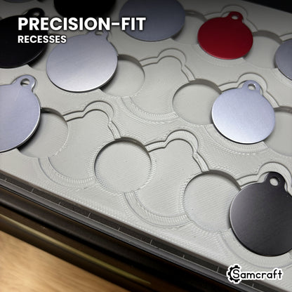 Close-up of the empty nested recesses in the Samcraft round pet tag jig, showing the precision-fit outer step and inner recess at every position.