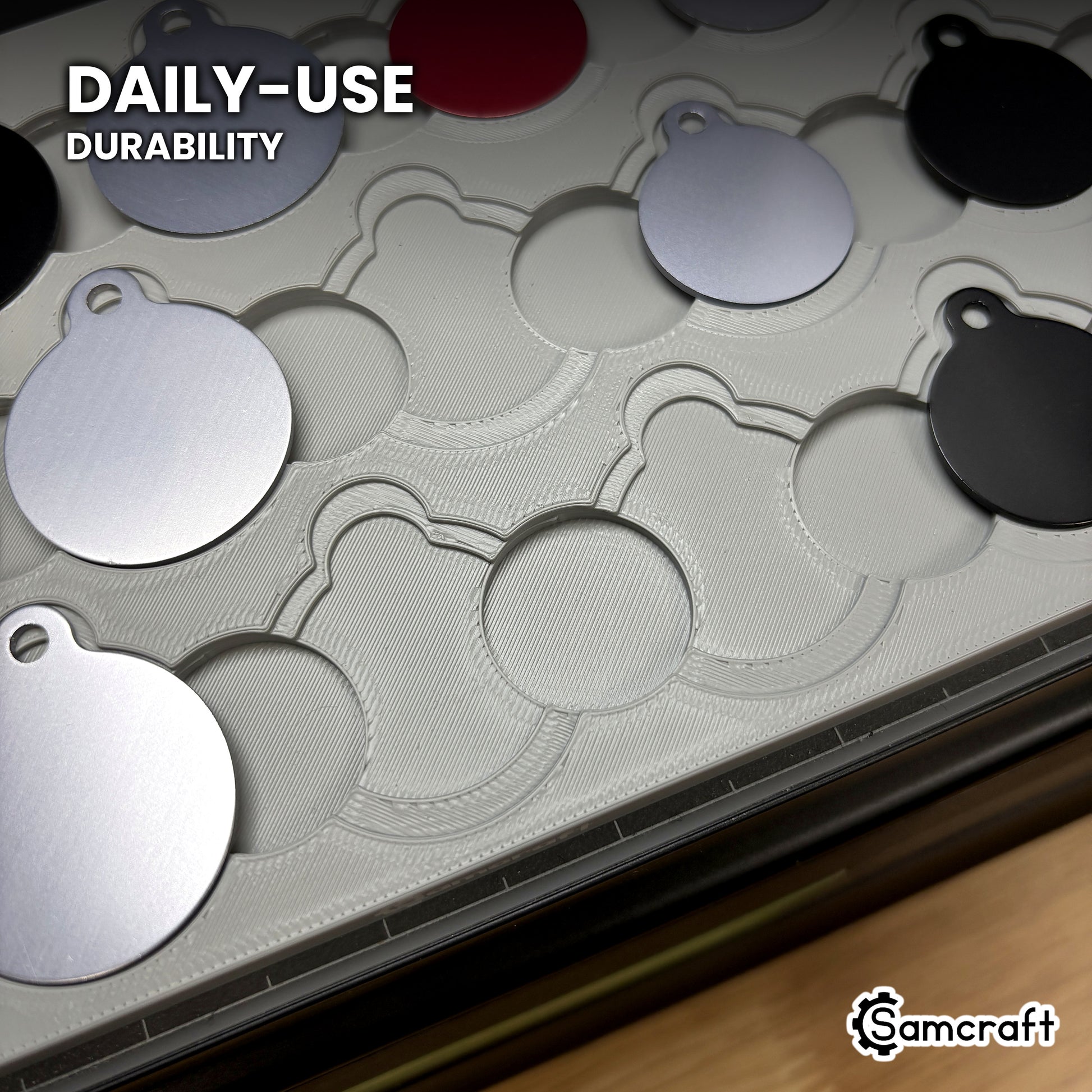 Close-up of the Samcraft round pet tag jig in high-temperature rated plastic with tags part-loaded, built for daily-use durability.