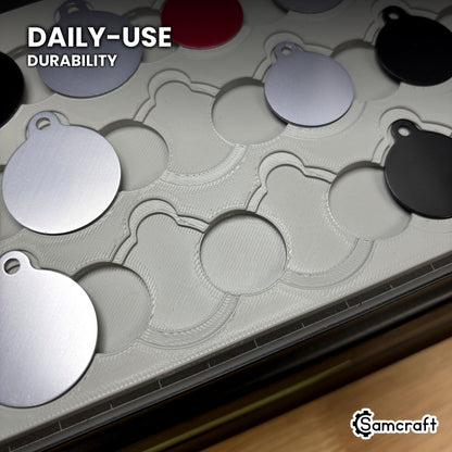 Close-up of the Samcraft round pet tag jig in high-temperature rated plastic with tags part-loaded, built for daily-use durability.