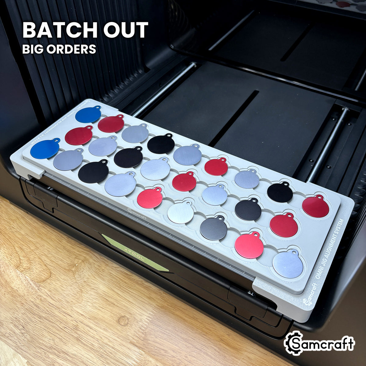 Samcraft round pet tag jig packed with 26 colored aluminum round tags, showing the batch volume a single run covers.