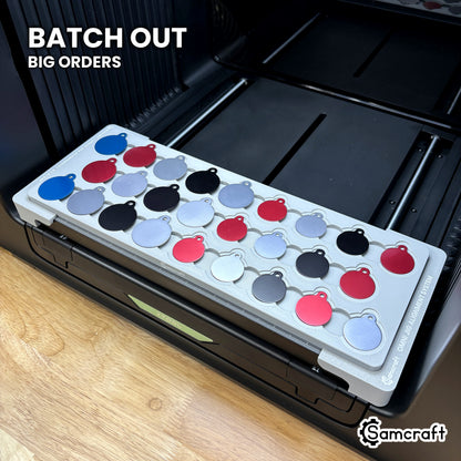 Samcraft round pet tag jig packed with 26 colored aluminum round tags, showing the batch volume a single run covers.