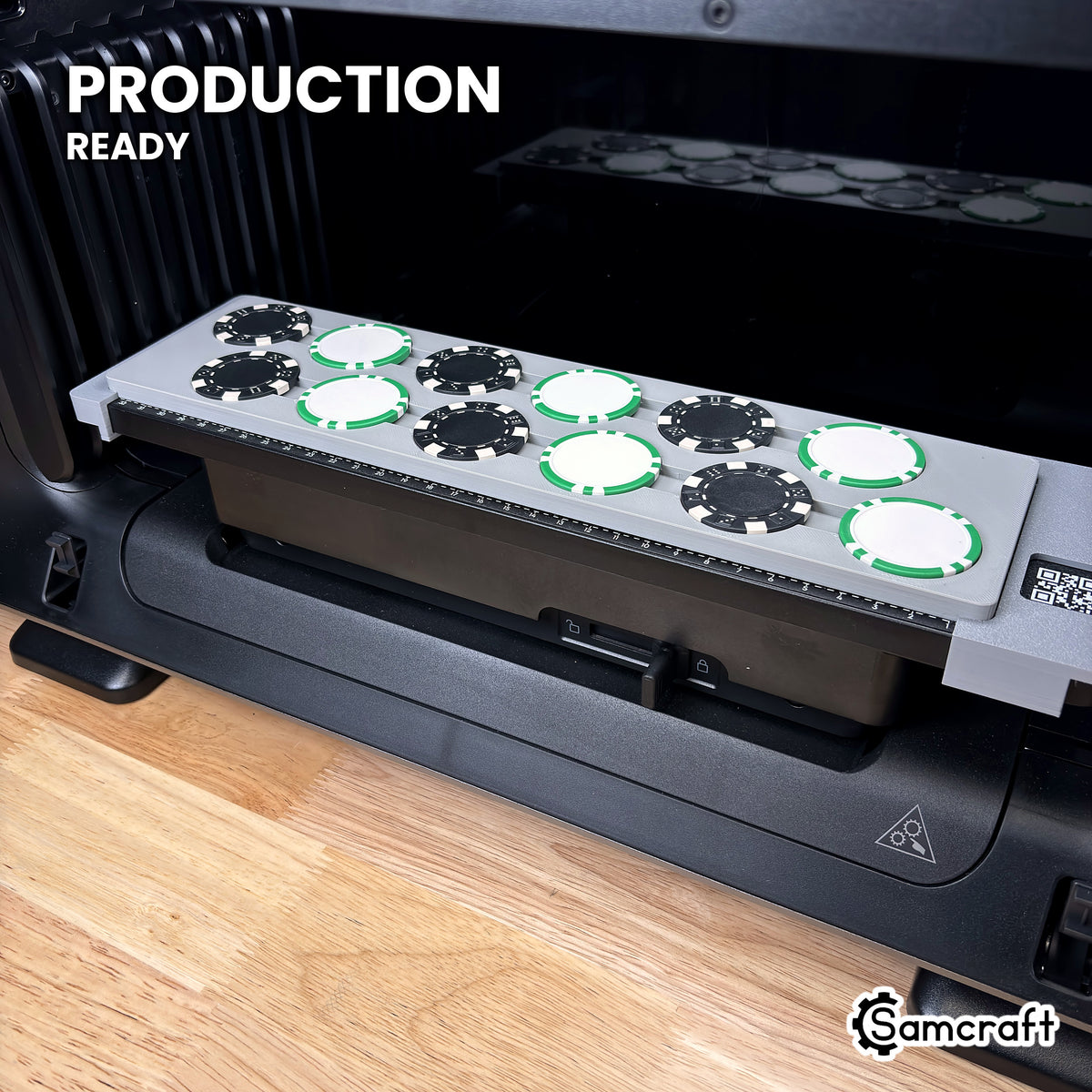 Samcraft poker chip jig loaded with 12 chips on the eufyMake E1 UV printer bed, set up for production runs.