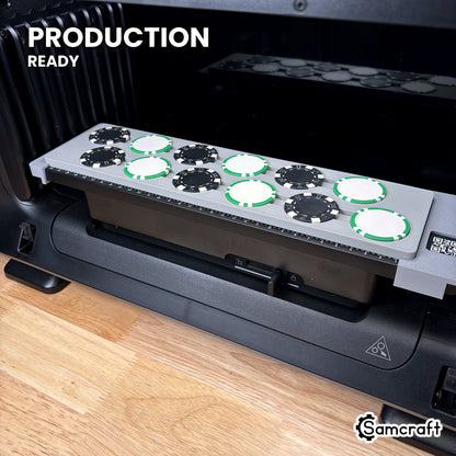 Samcraft poker chip jig loaded with 12 chips on the eufyMake E1 UV printer bed, set up for production runs.