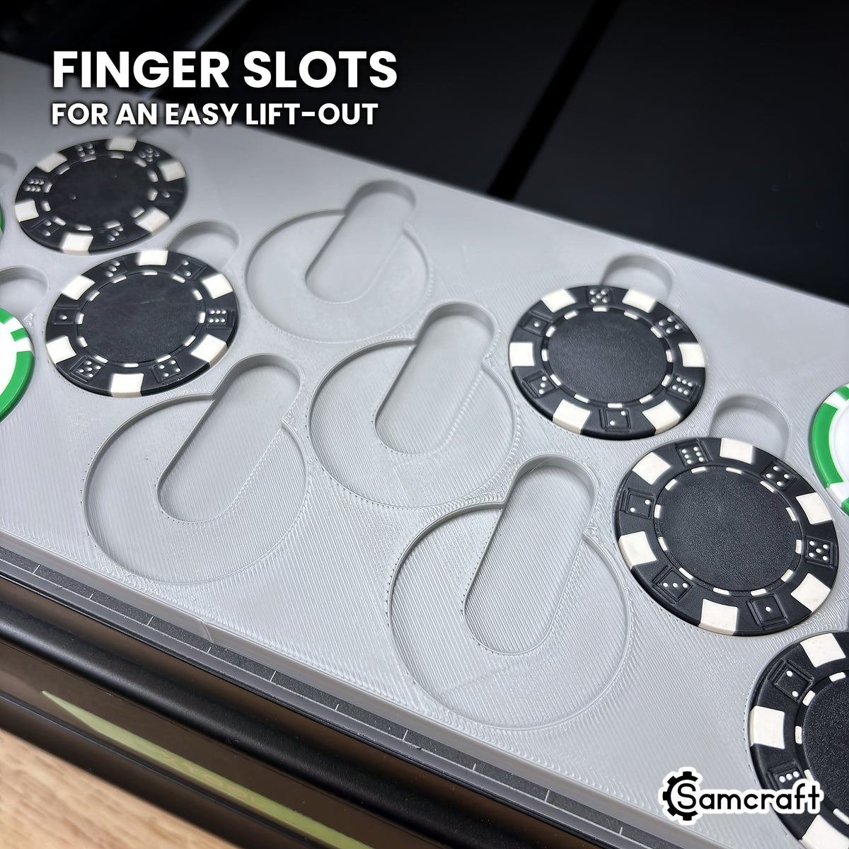 Close-up of the Samcraft xTool Omni poker chip jig with several pockets empty, showing the finger slot above each pocket for lifting chips out.