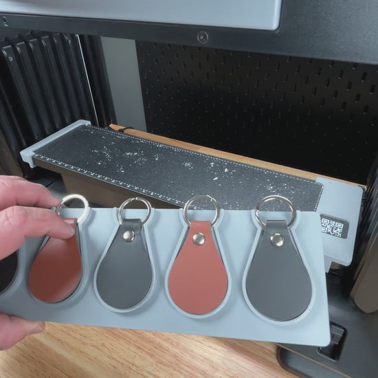 Video demonstration of the leather key fob keychain jig for the eufymake e1 uv printer in use.