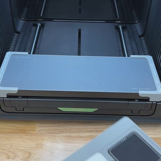 Video of the Samcraft square patch jig for the xTool Omni UV printer being loaded with leatherette patches and placed on the printer bed.