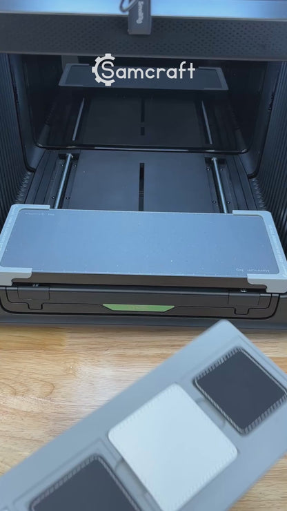 Video of the Samcraft square patch jig for the xTool Omni UV printer being loaded with leatherette patches and placed on the printer bed.