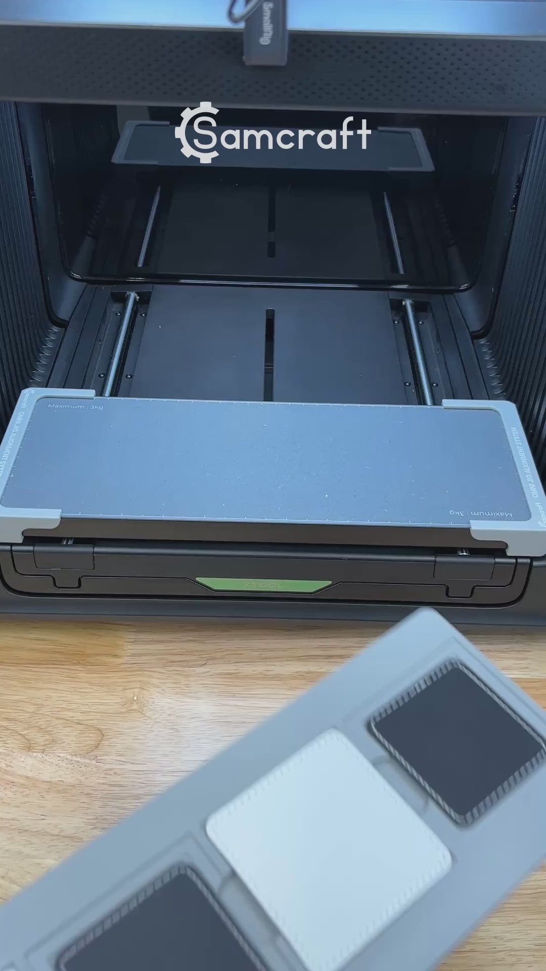 Video of the Samcraft square patch jig for the xTool Omni UV printer being loaded with leatherette patches and placed on the printer bed.