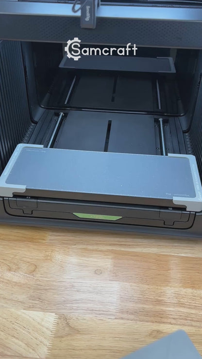 Video of the Samcraft round wooden bottle opener jig for the xTool Omni UV printer being loaded with openers and placed on the printer bed.