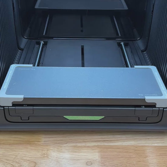 Video of the Samcraft military dog tag jig for the xTool Omni UV printer being loaded with anodized tags and placed on the printer bed.