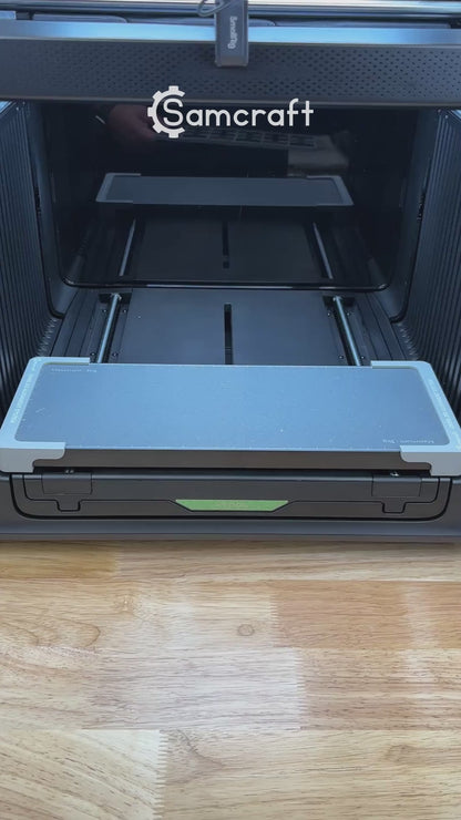 Video of the Samcraft military dog tag jig for the xTool Omni UV printer being loaded with anodized tags and placed on the printer bed.