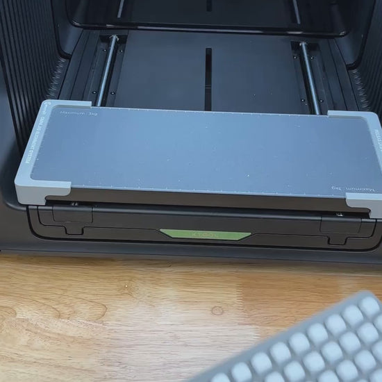 Video of the Samcraft 10mm dice jig for the xTool Omni UV printer being loaded with blank dice and placed on the printer bed.