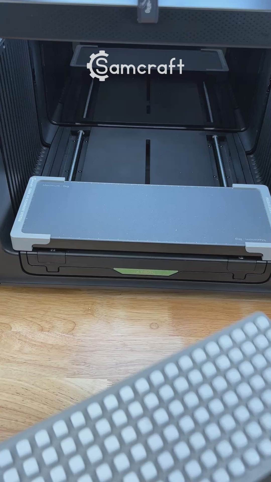 Video of the Samcraft 10mm dice jig for the xTool Omni UV printer being loaded with blank dice and placed on the printer bed.