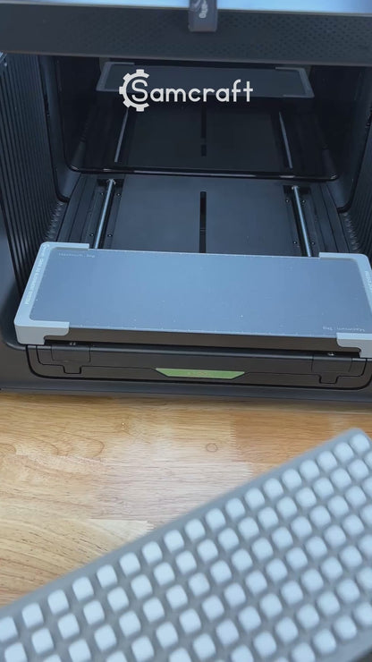 Video of the Samcraft 10mm dice jig for the xTool Omni UV printer being loaded with blank dice and placed on the printer bed.