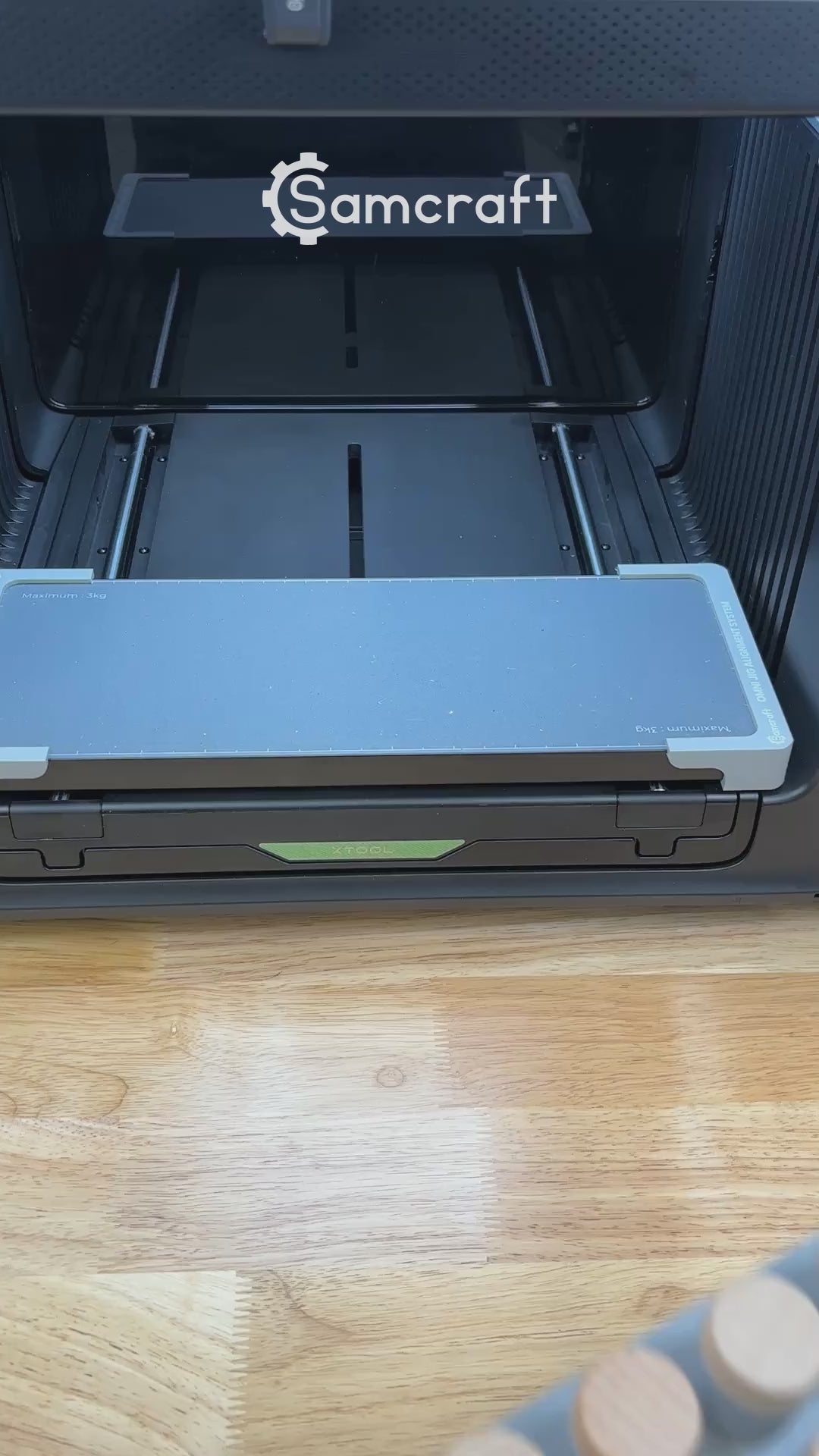 Video of the Samcraft bottle stopper jig for the xTool Omni UV printer being loaded with wooden bottle stoppers and placed on the printer bed.