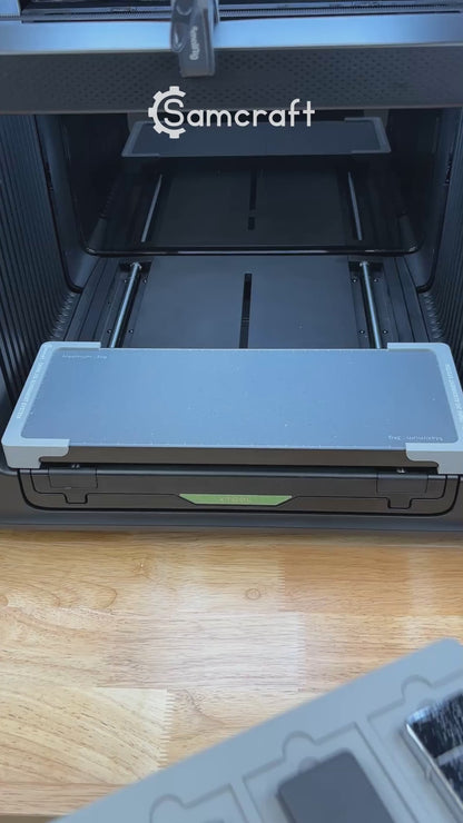 Video of the Samcraft flip top lighter jig for the xTool Omni UV printer being loaded with lighters and placed on the printer bed.