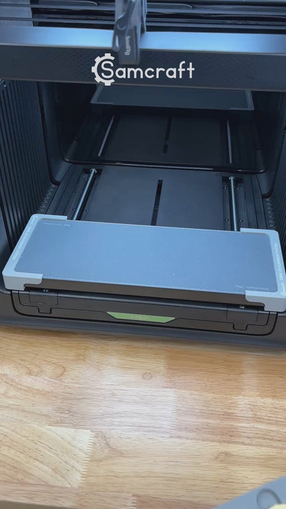 Video of the Samcraft 50mm metal coin jig for the xTool Omni UV printer being loaded with blank challenge coins and placed on the printer bed.