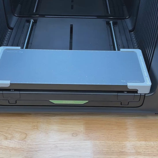 Video of the Samcraft business card and ID badge jig for the xTool Omni UV printer being loaded with card blanks and placed on the printer bed.