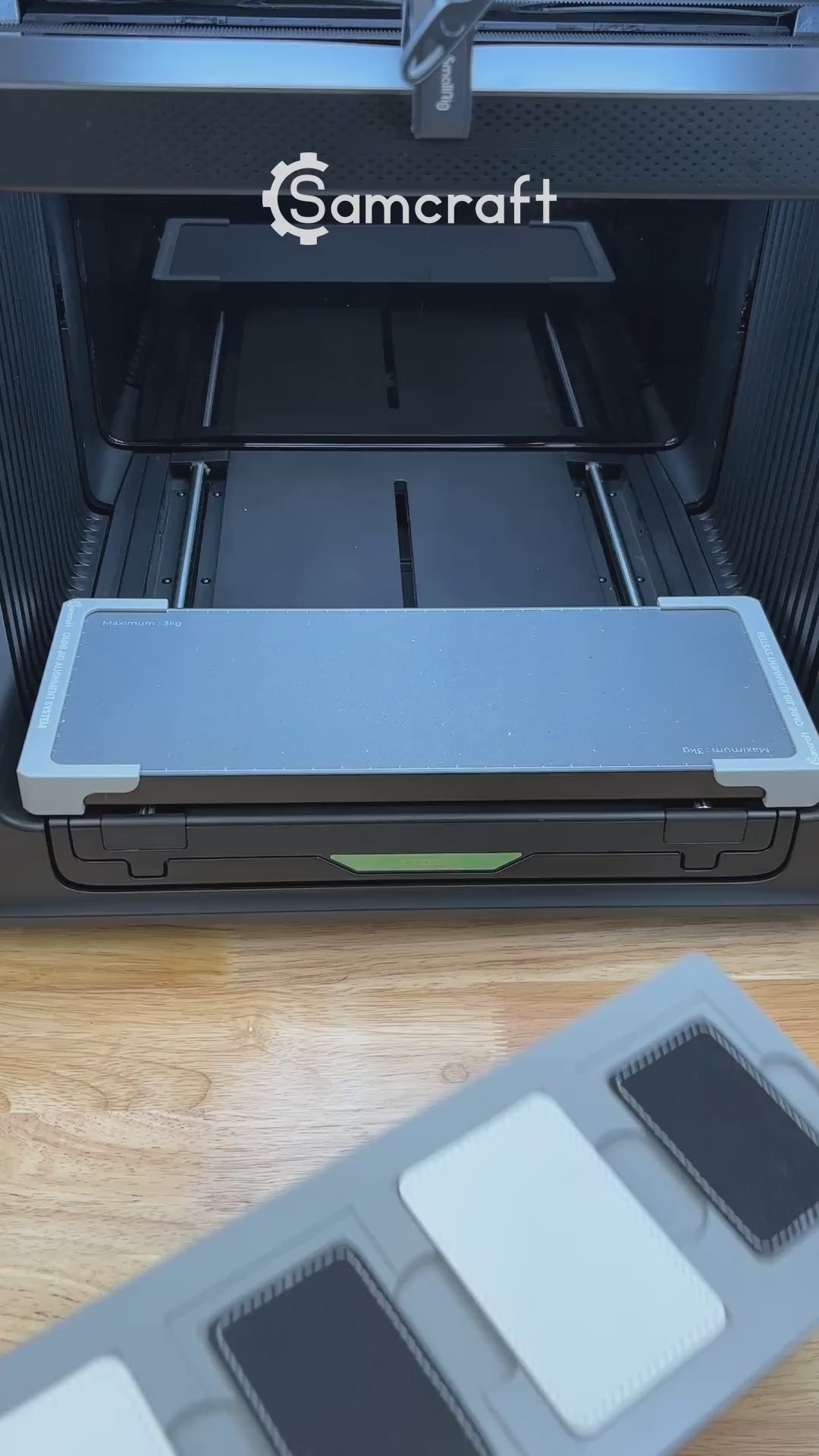 Video of the Samcraft rectangle patch jig for the xTool Omni UV printer being loaded with leatherette patches and placed on the printer bed.