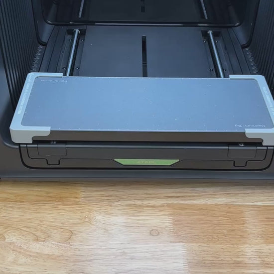 Video of the Samcraft 2x6 bookmark jig for the xTool Omni UV printer being loaded with bookmarks and placed on the printer bed.