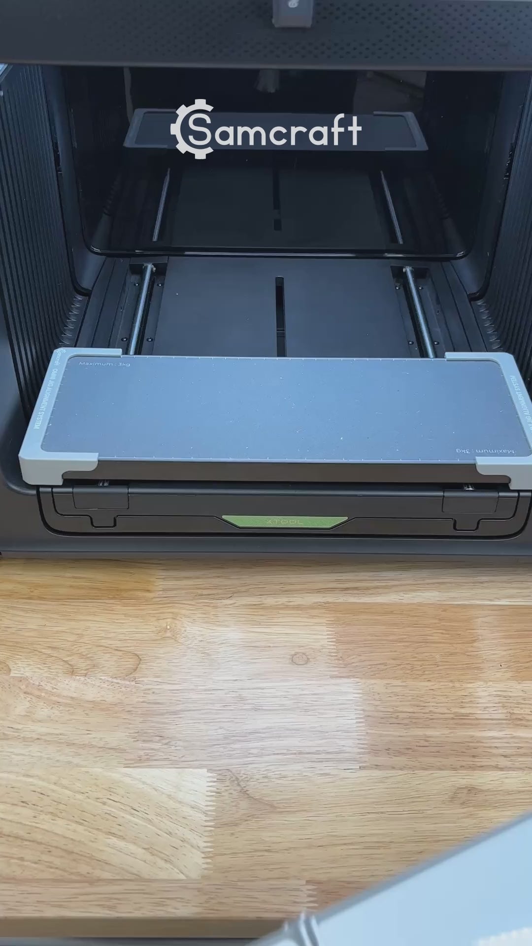 Video of the Samcraft 2x6 bookmark jig for the xTool Omni UV printer being loaded with bookmarks and placed on the printer bed.