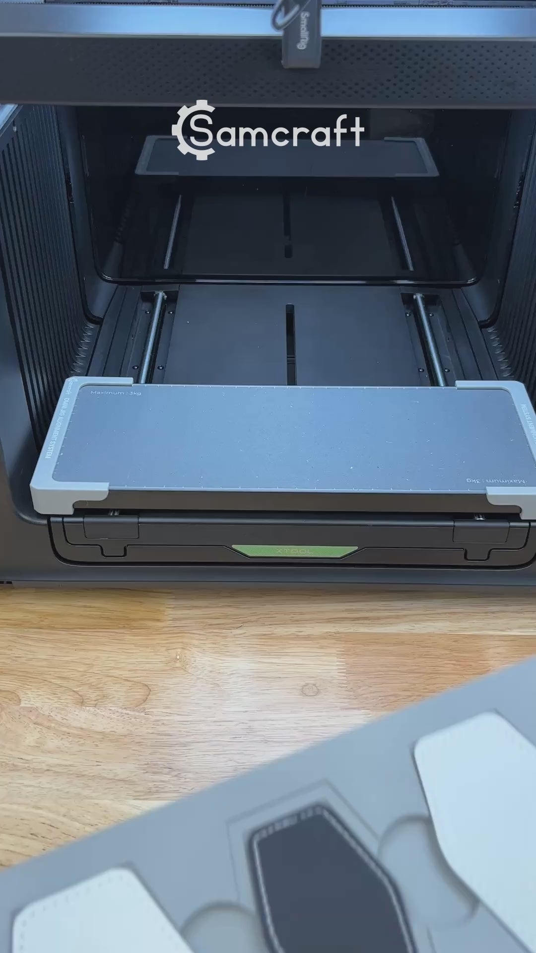 Video of the Samcraft hex patch jig for the xTool Omni UV printer being loaded with leatherette patches and placed on the printer bed.