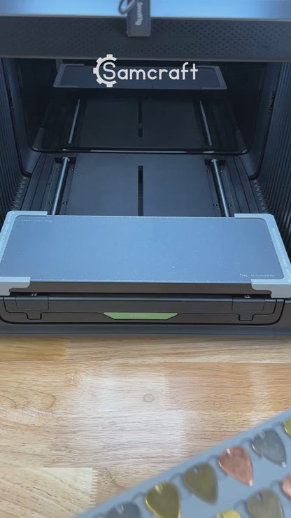 Video of the Samcraft guitar pick jig for the xTool Omni UV printer being loaded with guitar picks and placed on the printer bed.
