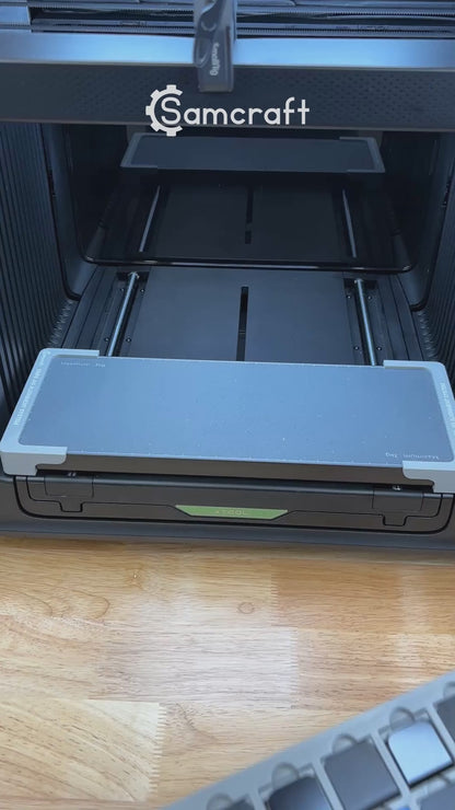 Video of the Samcraft hat brim clip jig for the xTool Omni UV printer being loaded with clips and placed on the printer bed.
