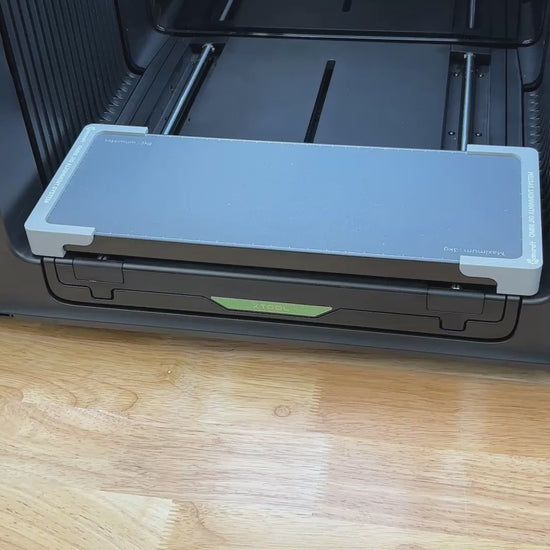 Video of the Samcraft baseball, softball and pickleball jig for the xTool Omni UV printer, with balls seated in the spherical cradles on the printer bed.