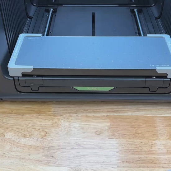 Video of the Samcraft house tag keychain jig for the xTool Omni UV printer being loaded with tags and placed on the printer bed.