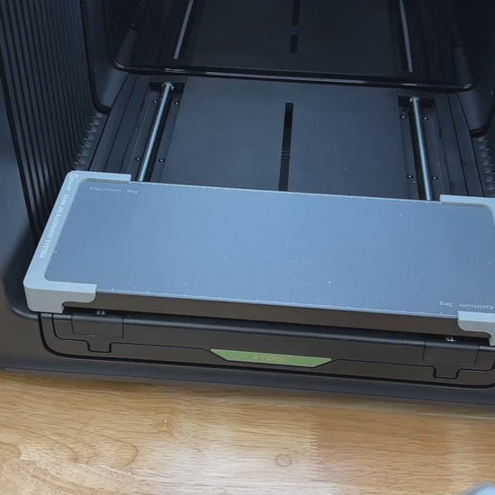 Video of the Samcraft 22mm dice jig for the xTool Omni UV printer being loaded with blank dice and placed on the printer bed.